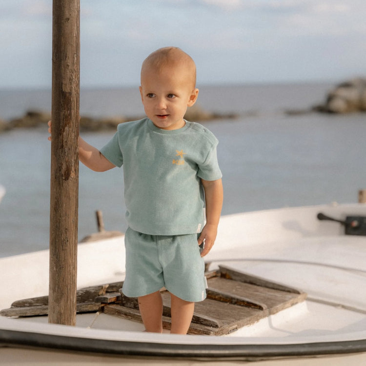 LITTLE DUTCH. Σετ μπλουζάκι και κοντό παντελονάκι Seashells and Stripes Surf Blue