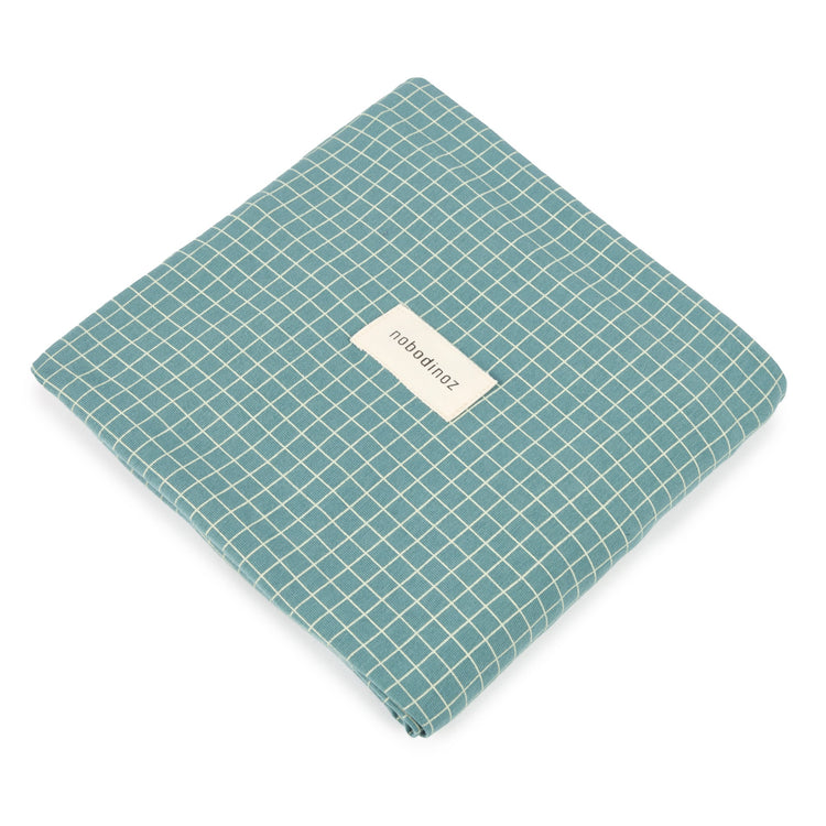 ##STORIES. Changing cover Limited edition - organic cotton jersey Teal Cream Grid 50x70